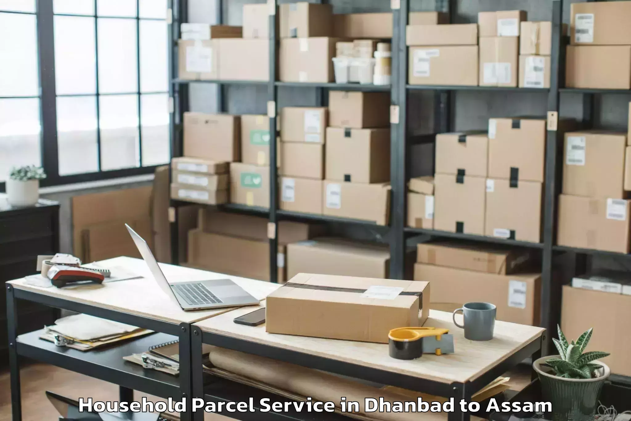 Easy Dhanbad to Tezpur University Household Parcel Booking